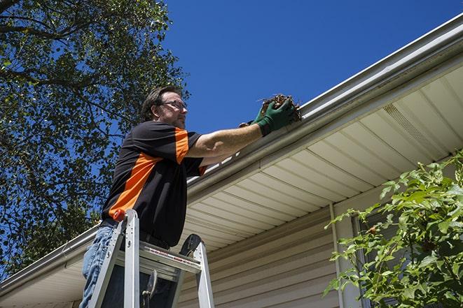 rusted rain gutter undergoing repair in Ballwin