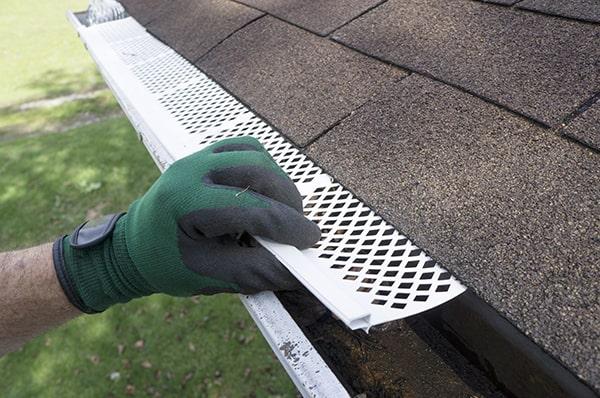 quality gutter guards are designed to handle heavy rainfall by allowing water to flow through while keeping debris out